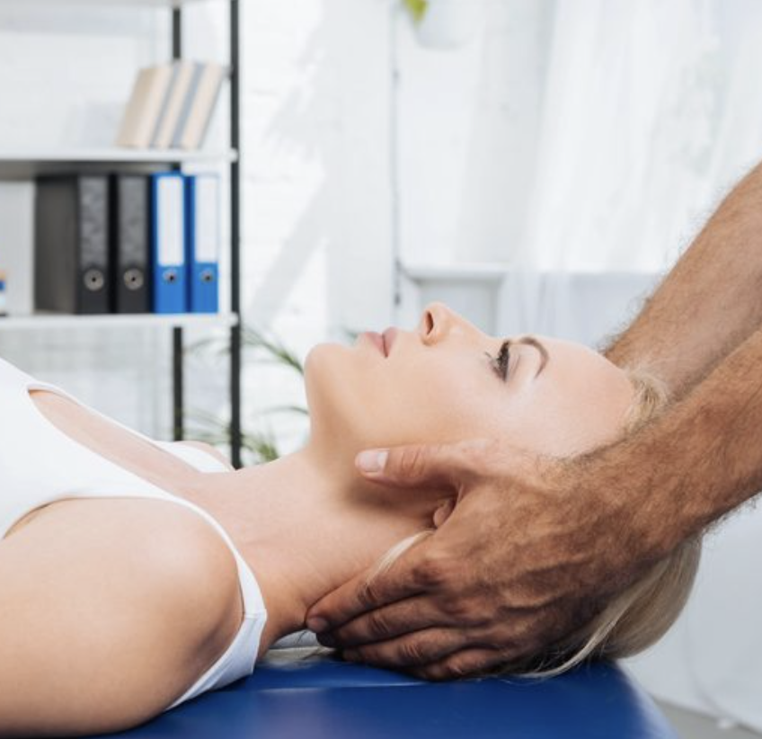 Manual chiropractic cervical adjustment at Optimum Chiropractic Care Mobile Alabama