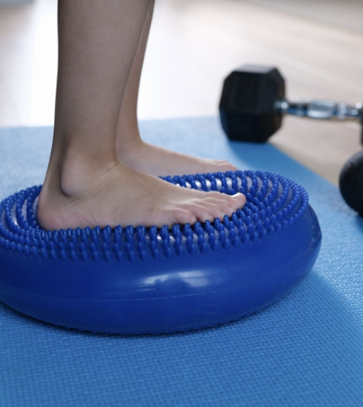 Therapeutic exercise and rehabilitation — balance training at Optimum Chiropractic Care Mobile AL